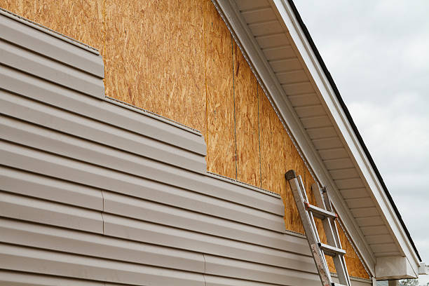 Professional Emergency Siding Repair technician working in Topping, VA
